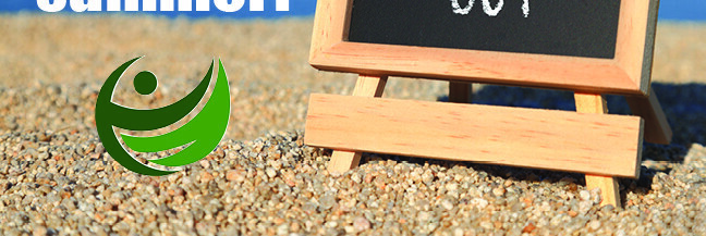 'School's out' written on a blackboard sitting on a beach