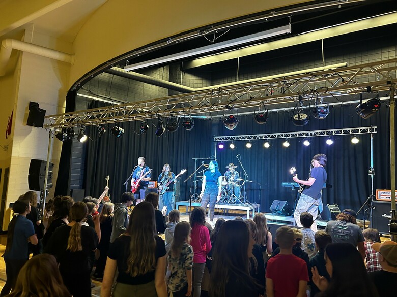 Band performing in school gymnasium